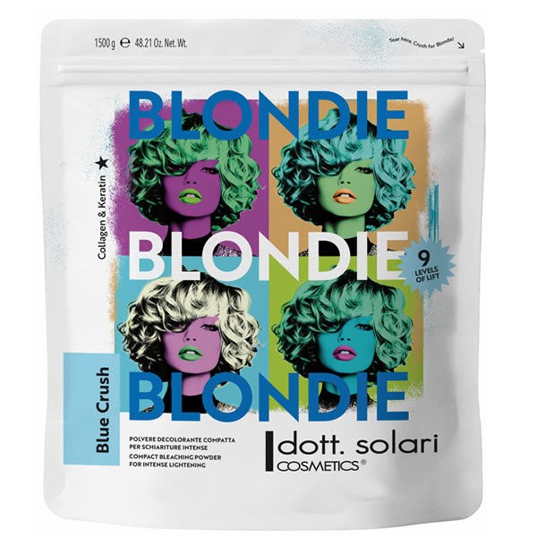 Белый пакет осветляющего порошка Dott. Solari Blondie Blue Crush массой 1500 г с поп-арт принтом женских лиц в разных цветовых вариациях.